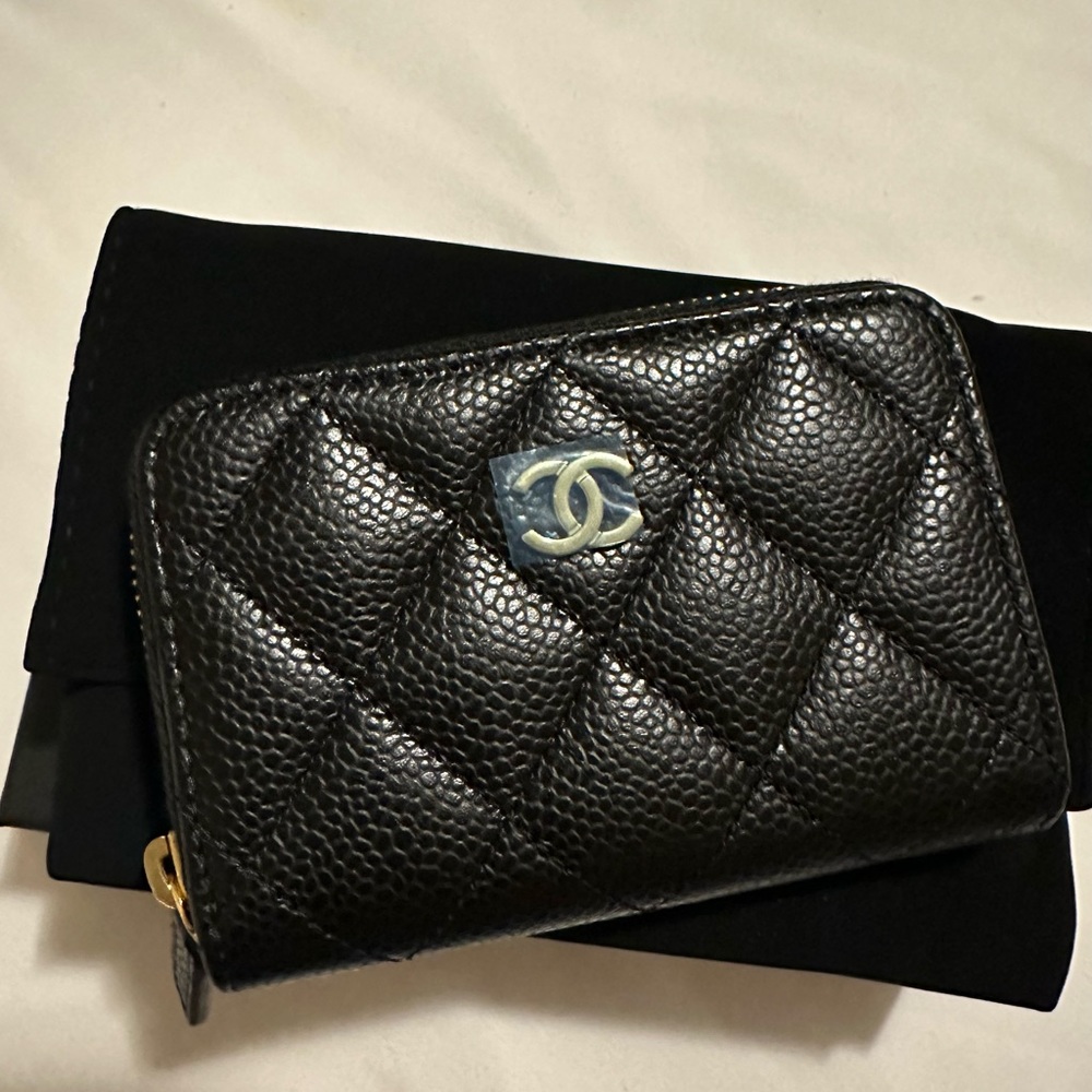 Brand new in box black caviar gold hardware Chanel coin purse. Beautiful piece.